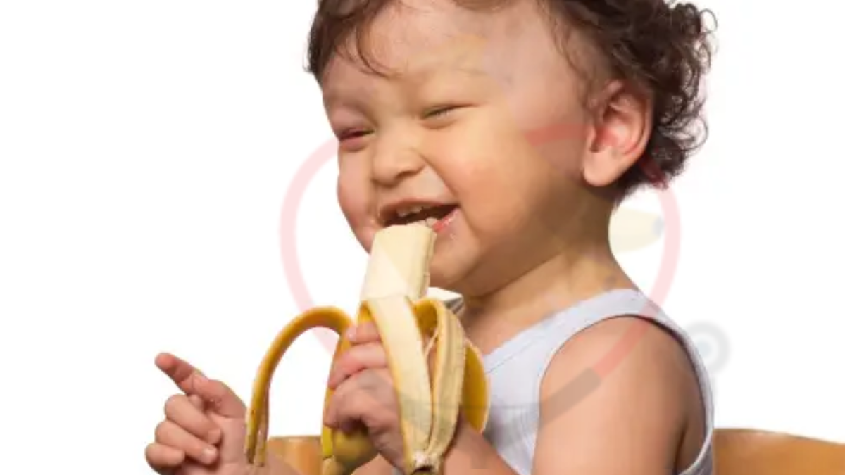 Image showing the baby eating a banana